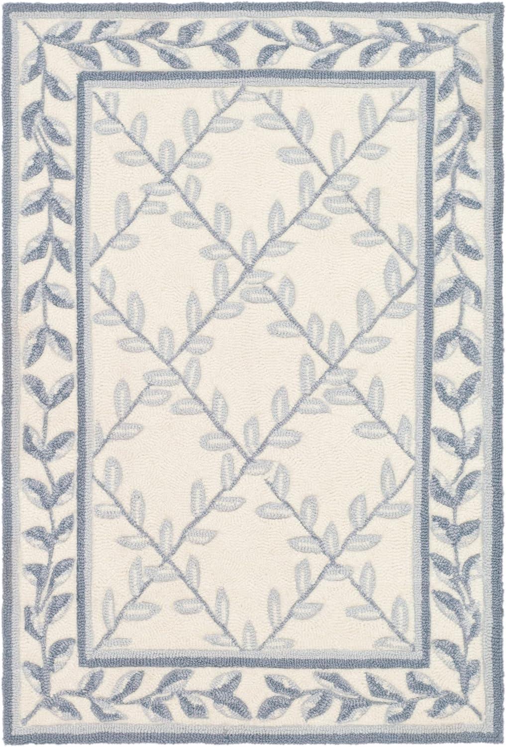 Ivory and Light Blue Tufted Synthetic Area Rug, 2' x 3'