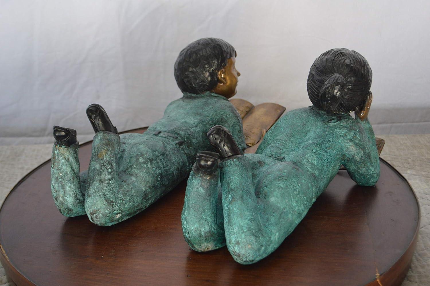 Set of a Boy and a Girl Reading a Book Bronze Statue - Size: 16"L x 7"W x 8"H.