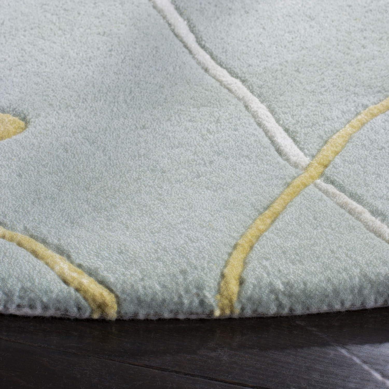 Soho SOH305 Hand Tufted Area Rug - Light Blue - 8' round - Safavieh.