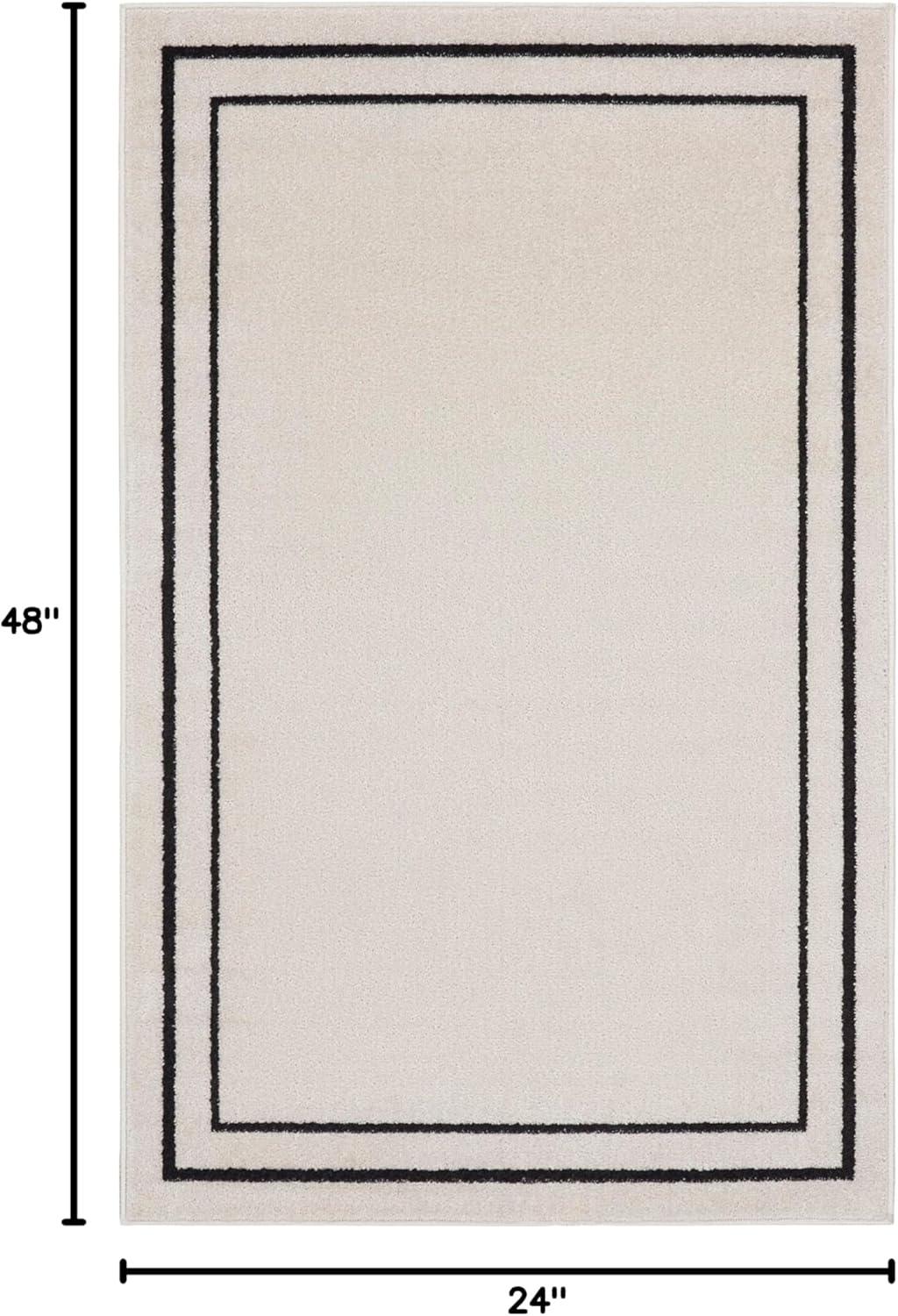 Nourison Essentials 2' x 4' Ivory/Black Contemporary Indoor/Outdoor Rug