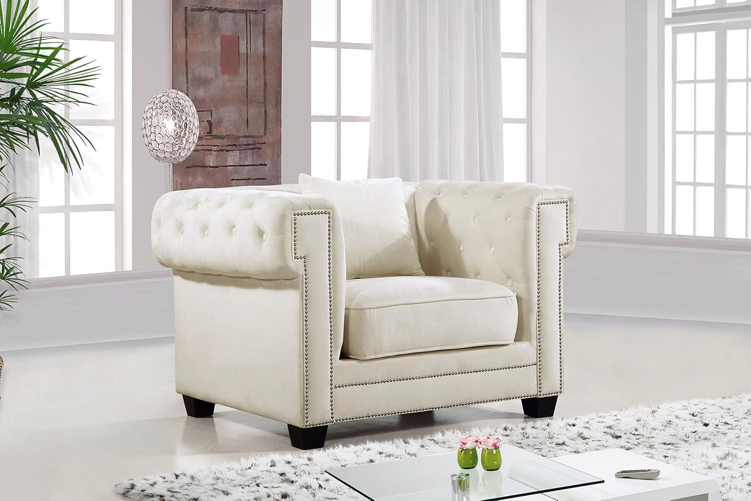 Elegant Cream Velvet Accent Chair with Metal Frame and Tufted Design