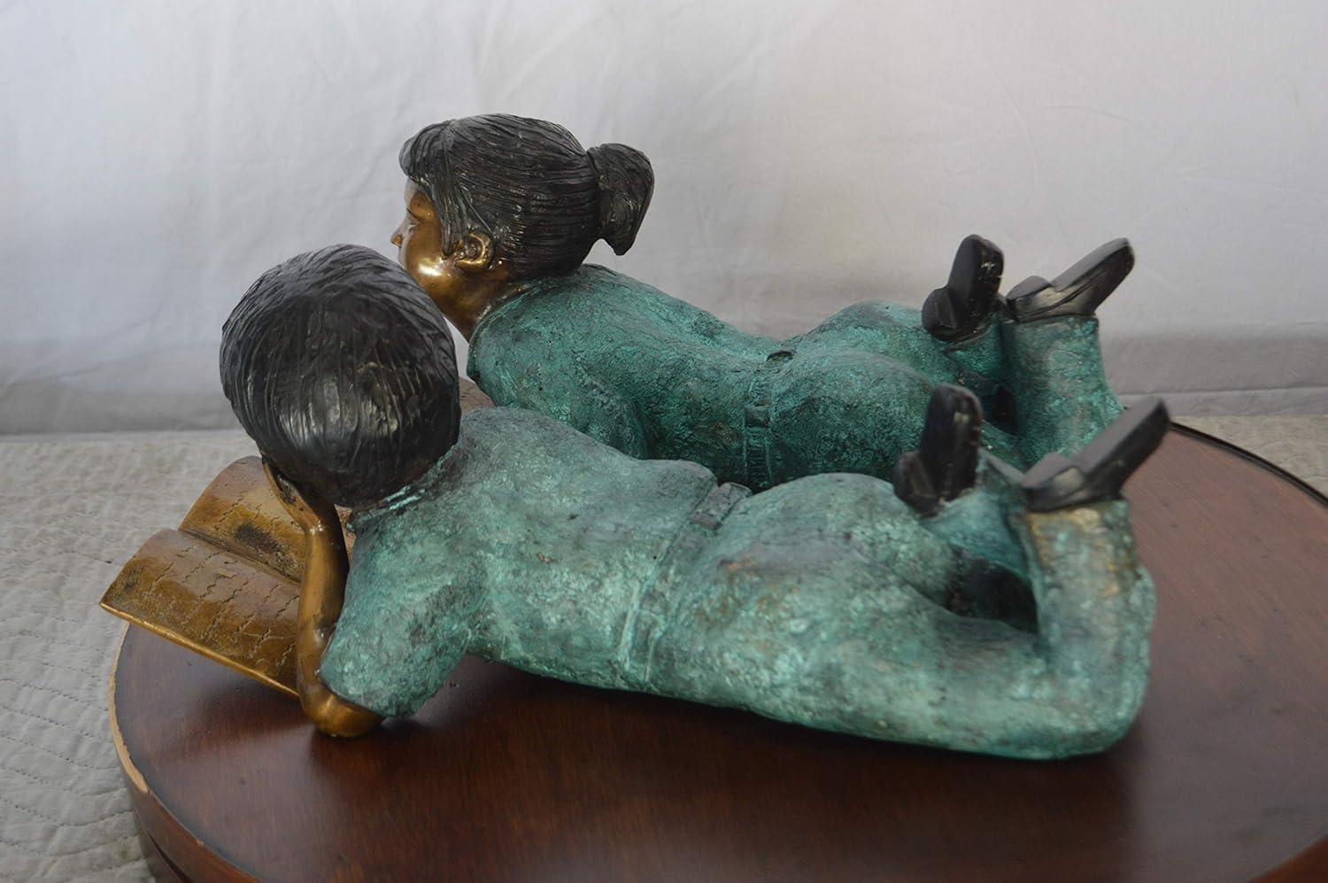 Set of a Boy and a Girl Reading a Book Bronze Statue - Size: 16"L x 7"W x 8"H.