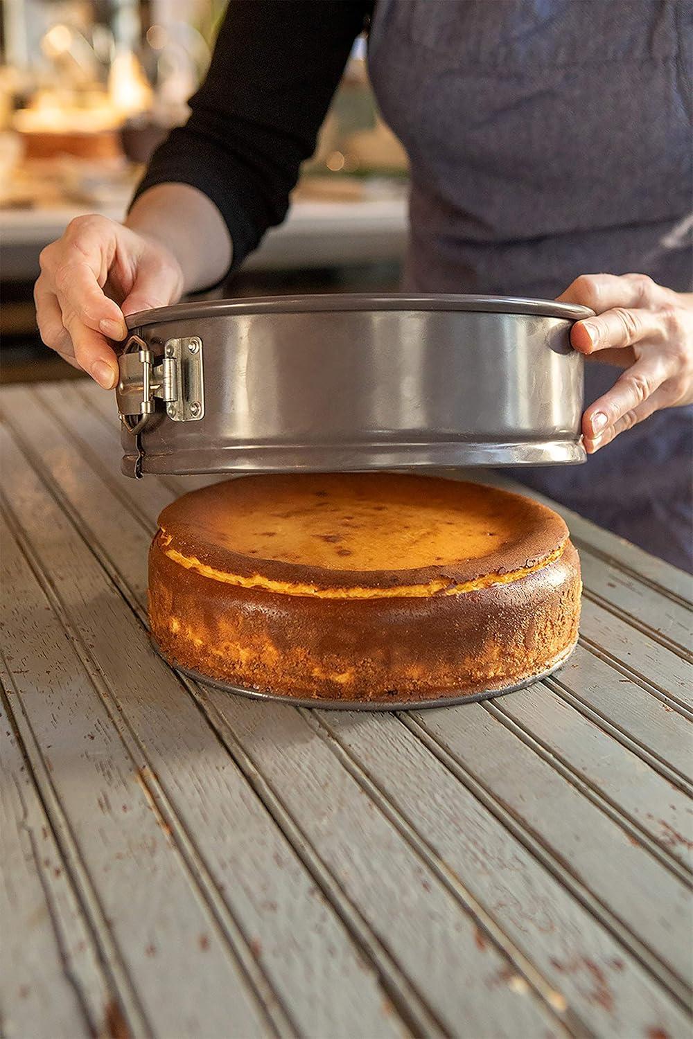 NutriChef 9 Inch Nonstick Cheesecake Springform Cake Pan | Stainless Steel Clasp & Removable Bottom | Durable Carbon Steel Cheesecake Pan | Easy to Clean | Includes 100 Parchment Papers | Black