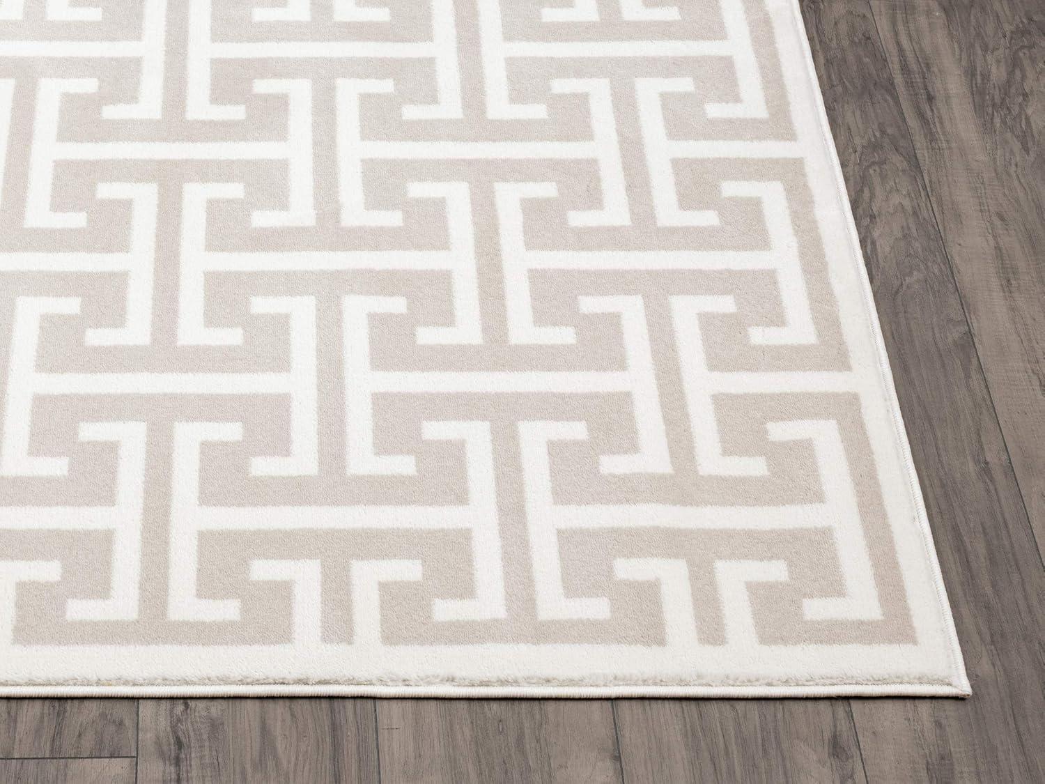 Beige and White Geometric 4' x 6' Synthetic Area Rug