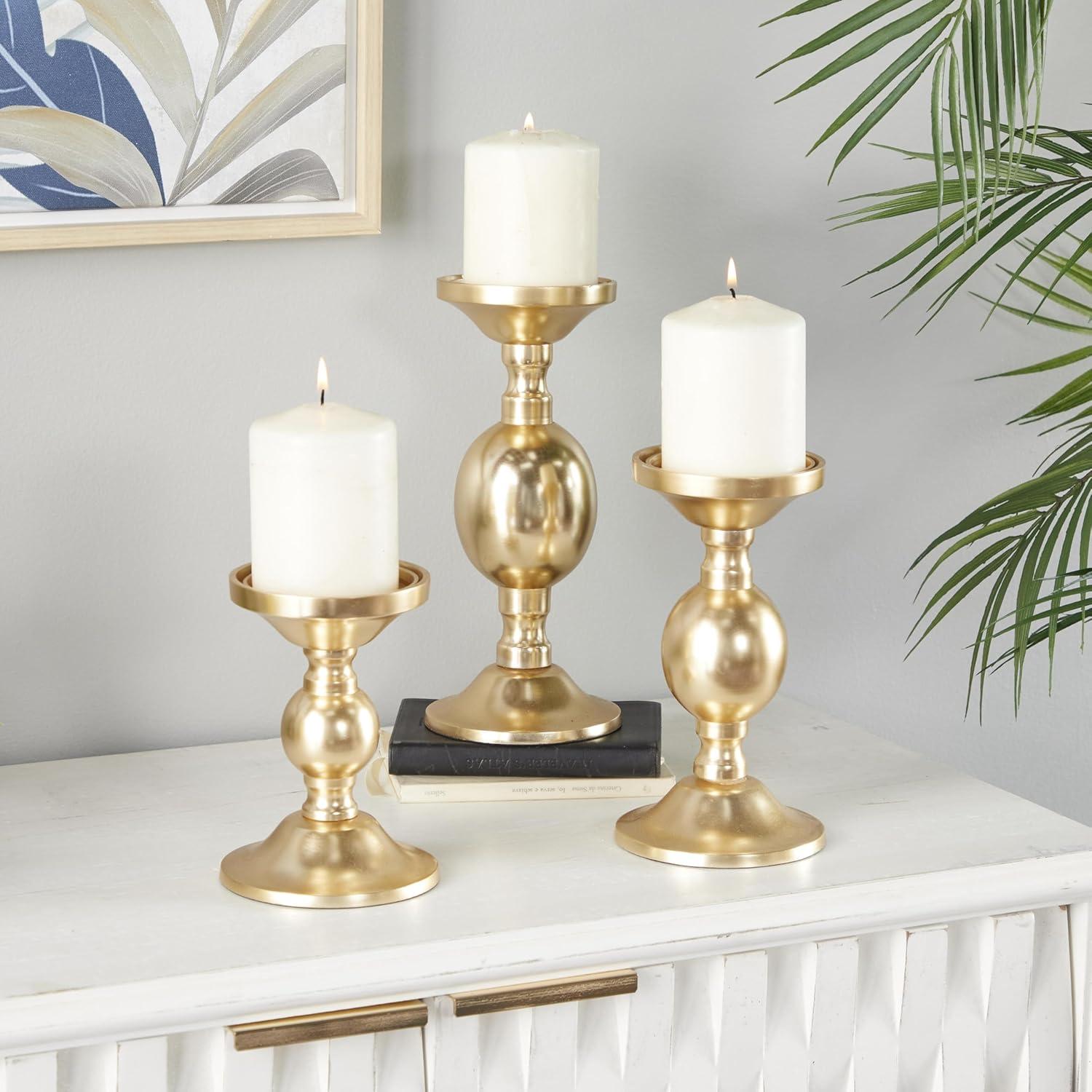 Deco 79 Aluminum Metal Decorative Candle Holder Pillar Candle Stand, Set of 3 Candlestick Holder 10", 8", 6"H, Gold