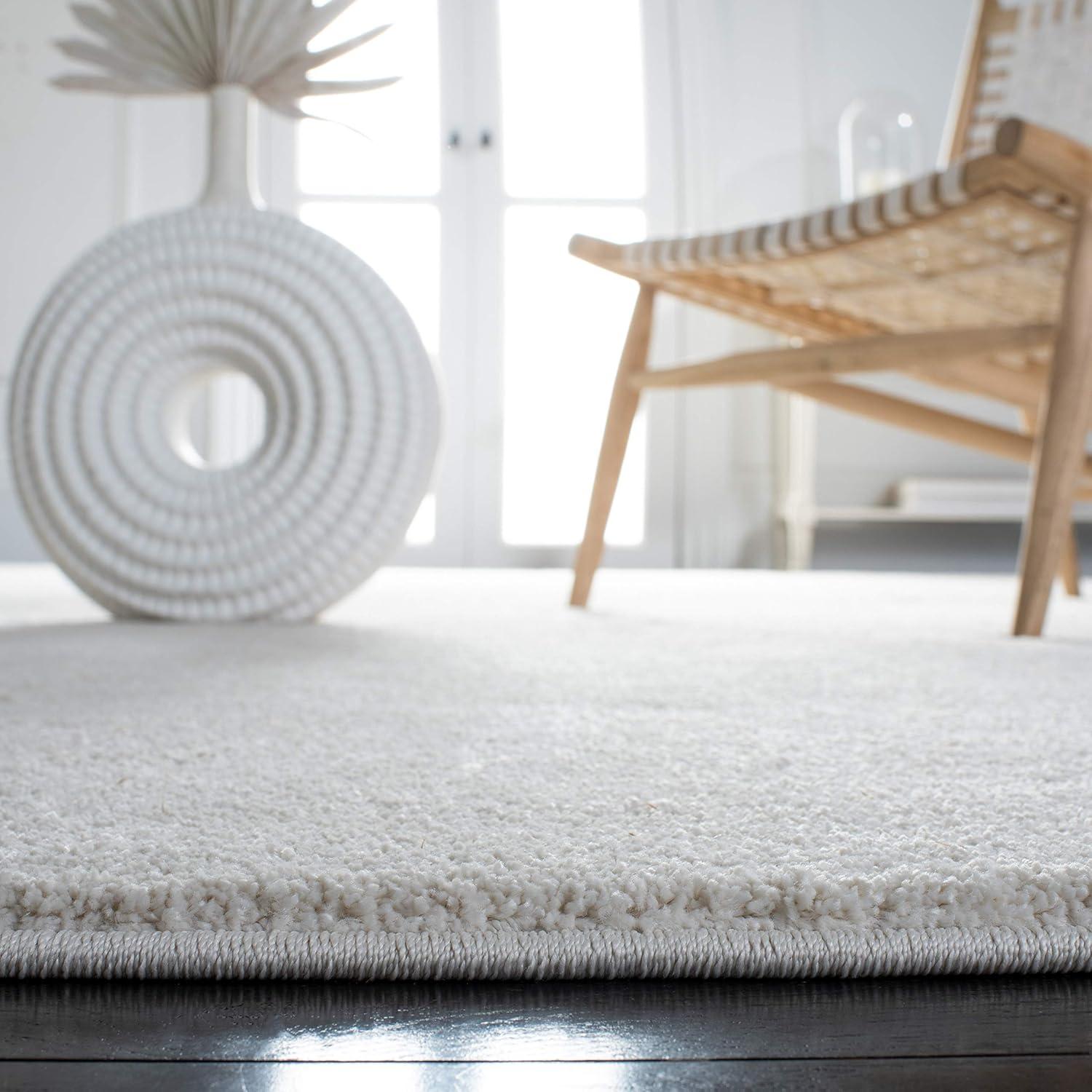 SAFAVIEH Plain and Solid Carleen Solid Plush Area Rug, Ivory, 4'5" x 6'5"