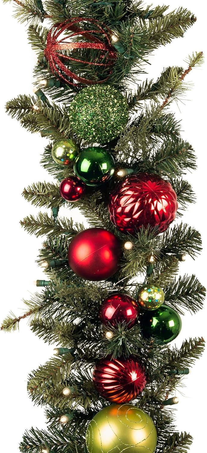 [9 Foot Artificial Christmas Garland] - Festive Holiday Collection - Red and Green Decoration - Pre Lit with 100 Warm Clear Colored LED Mini Lights - includes Remote Controlled Battery Powered Timer