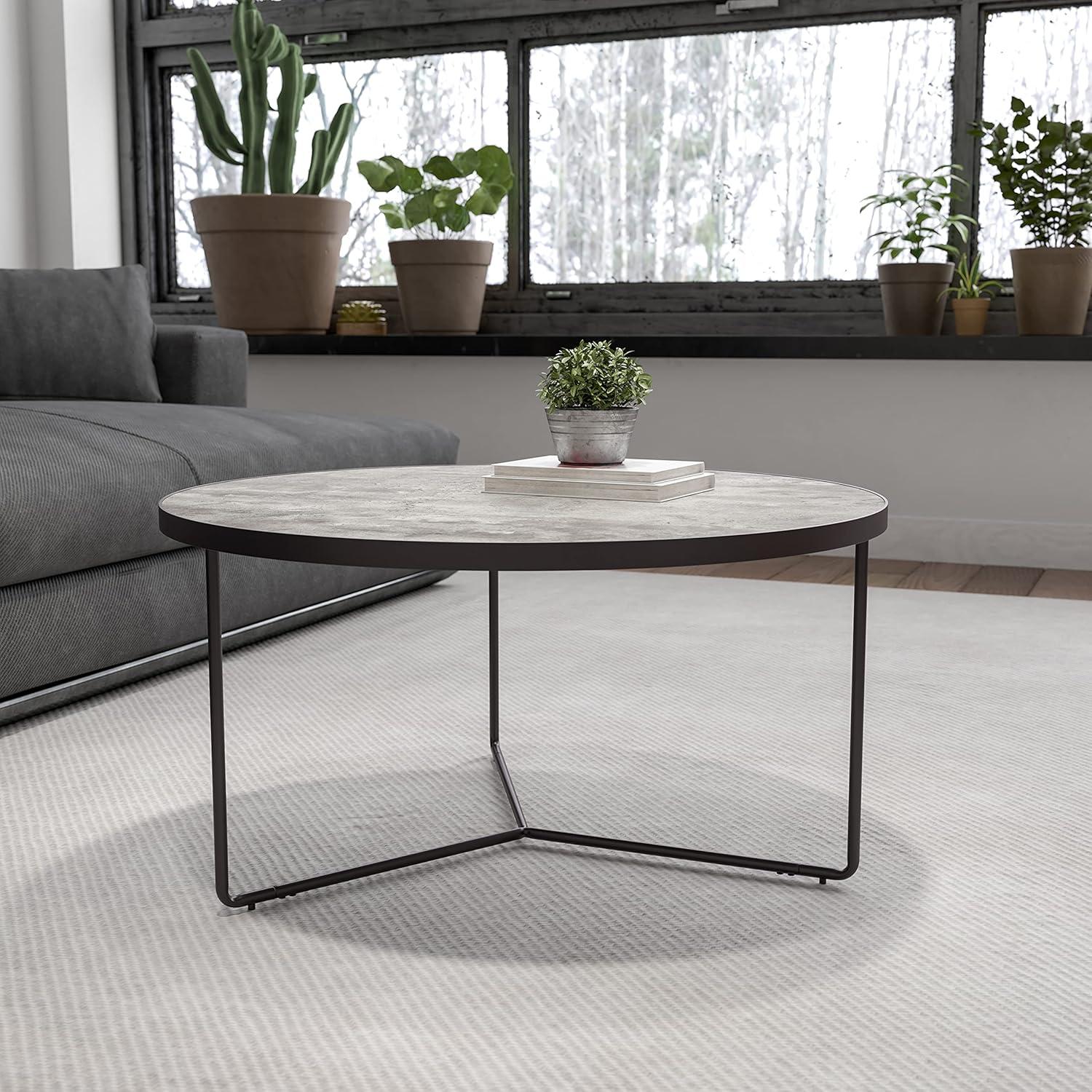 Round Gray Faux Concrete Coffee Table with Black Metal Frame