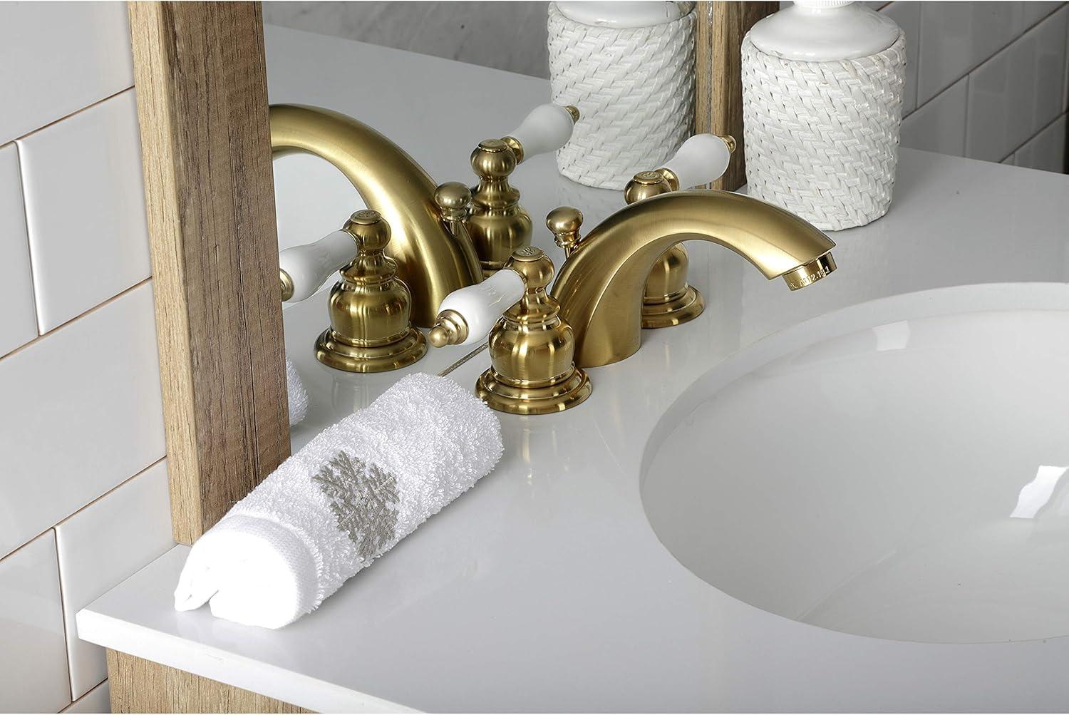 Kingston Brass Victorian Two-Handle 3-Hole Deck Mount Mini-Widespread Bathroom Faucet with Plastic Pop-Up