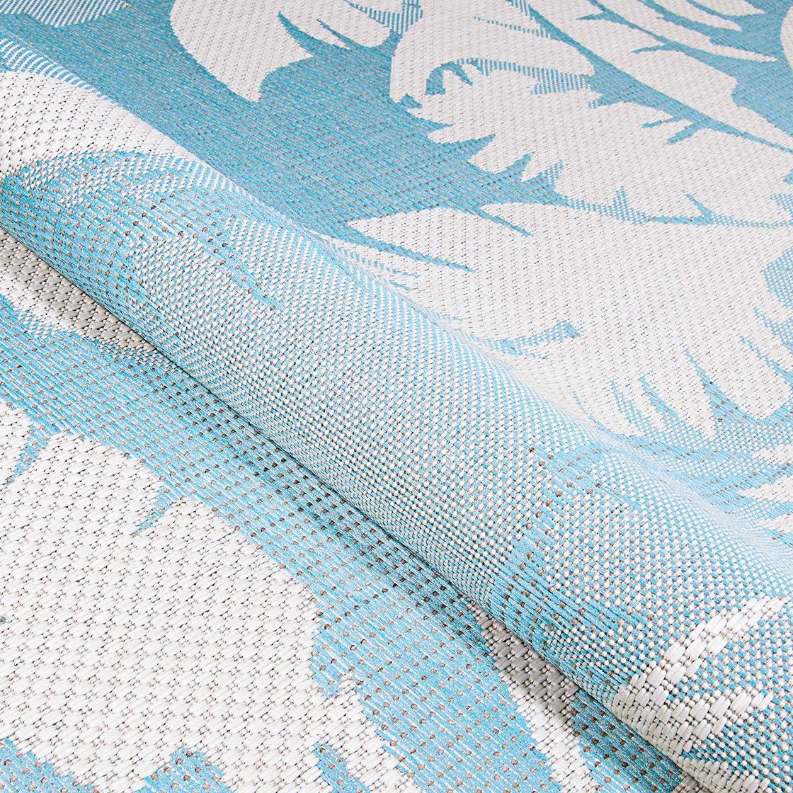 Ivory and Turquoise Synthetic Flat Woven Reversible Area Rug