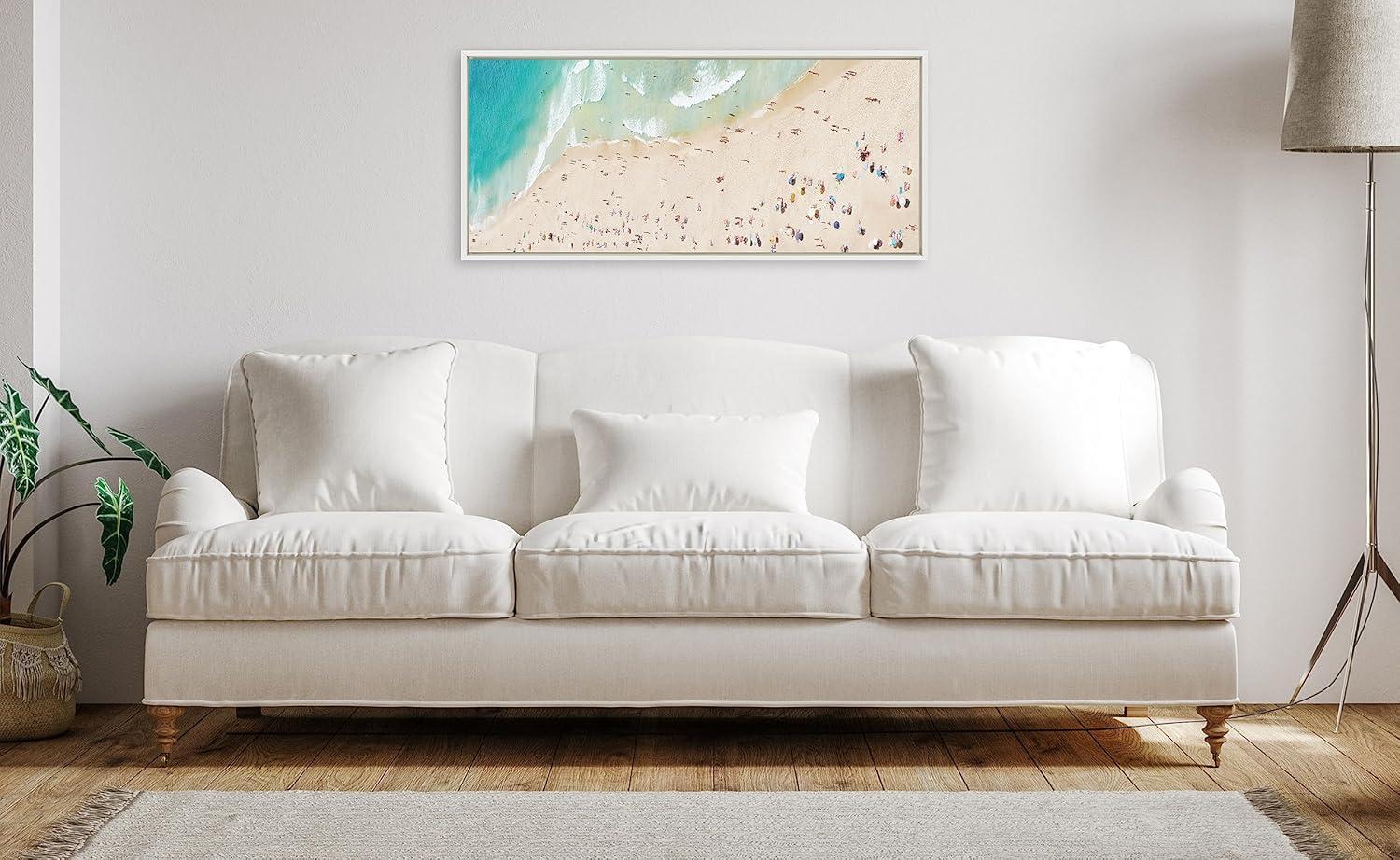 Kate and Laurel Sylvie Crowded Beach from Above Framed Canvas Wall Art by Amy Peterson Art Studio, 18x40 White, Coastal Beach Landscape Art for Wall