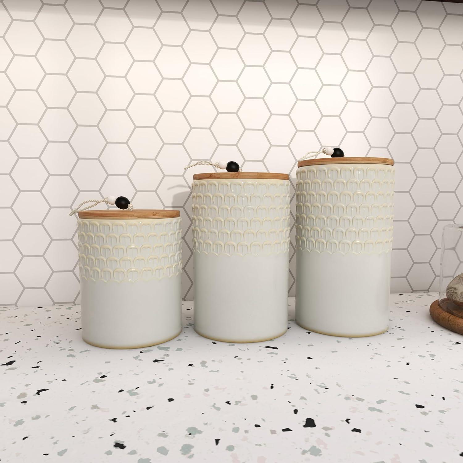 DecMode 9", 8", 7"H White Ceramic Textured Decorative Jars with Wood Lids and Beaded Accents, 3-Pieces