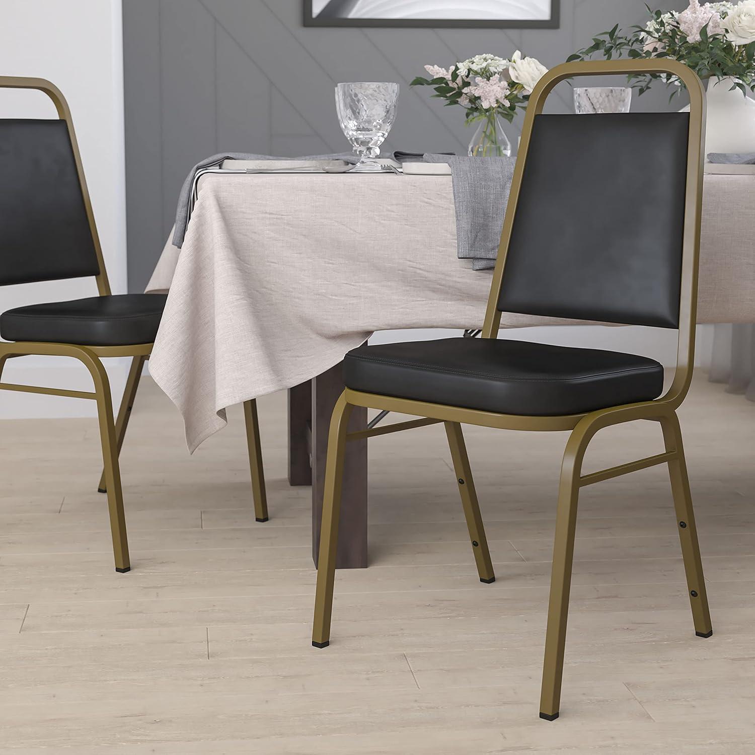 Emma and Oliver Trapezoidal Back Stacking Banquet Chair, Black Vinyl/Gold Frame