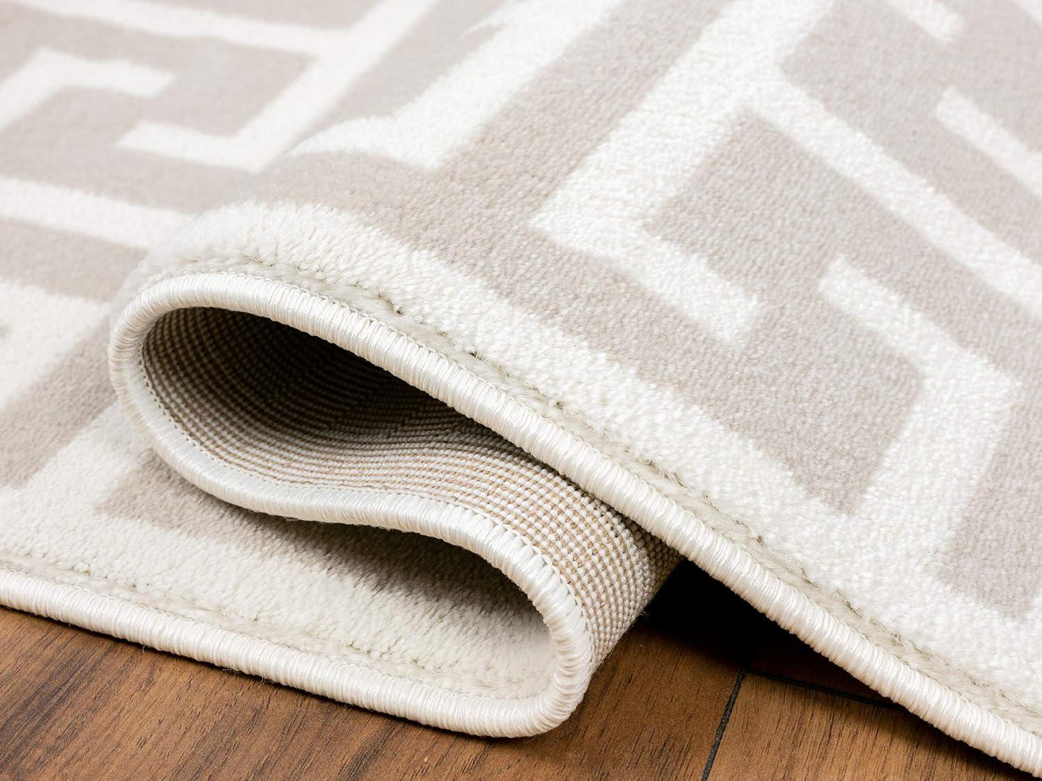 Beige and White Geometric 4' x 6' Synthetic Area Rug