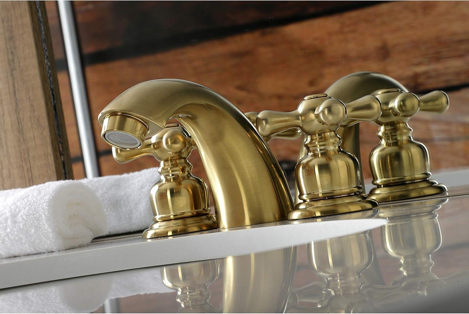 Kingston Brass Victorian Two-Handle 3-Hole Deck Mount Mini-Widespread Bathroom Faucet with Plastic Pop-Up