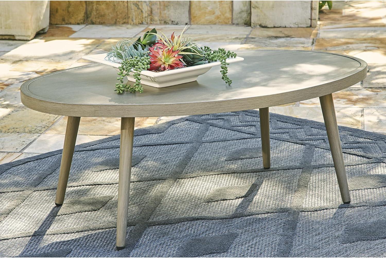 Signature Design by Ashley Swiss Valley Outdoor Oval Coffee Table, Beige