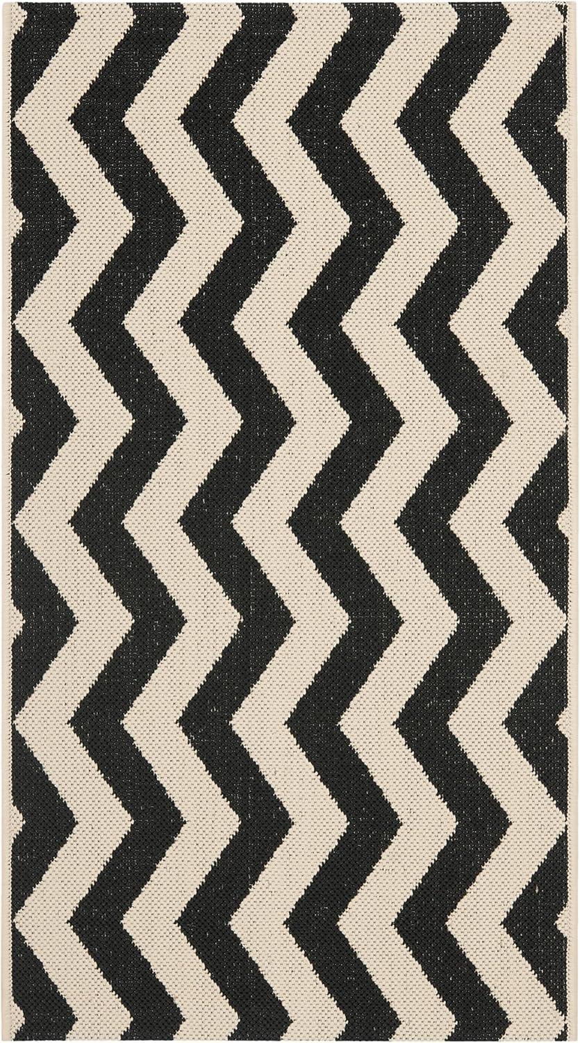 SAFAVIEH Courtyard Ayden Chevron Indoor/Outdoor Area Rug, Black/Beige, 2' x 3'7"