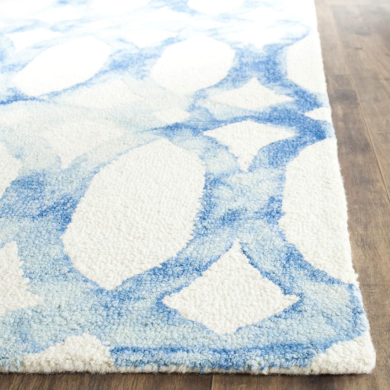 Amekia Hand Tufted Wool/Cotton Geometric Rug in Blue/Ivory