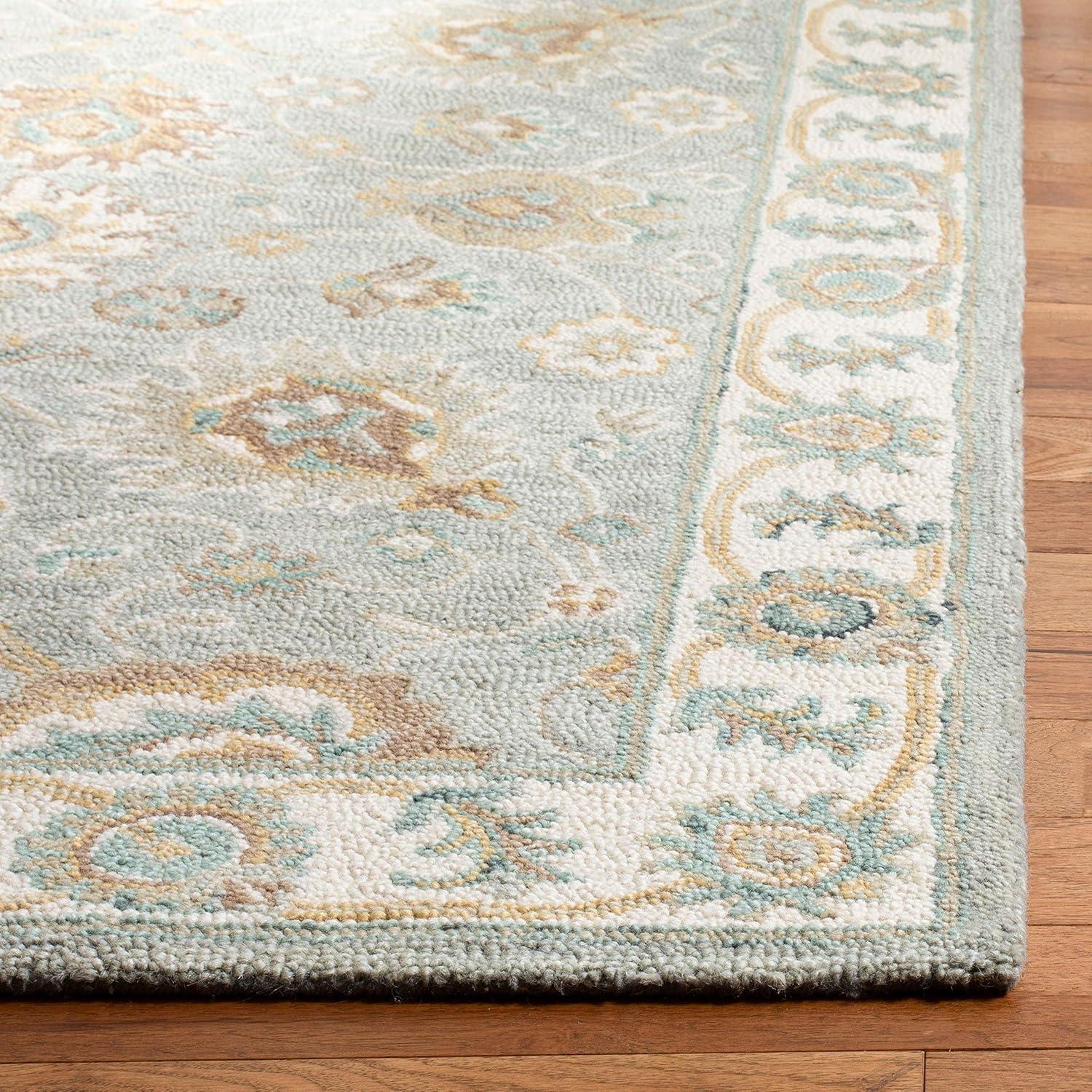 Handmade Ivory and Aqua Floral Wool Area Rug 5' x 8'