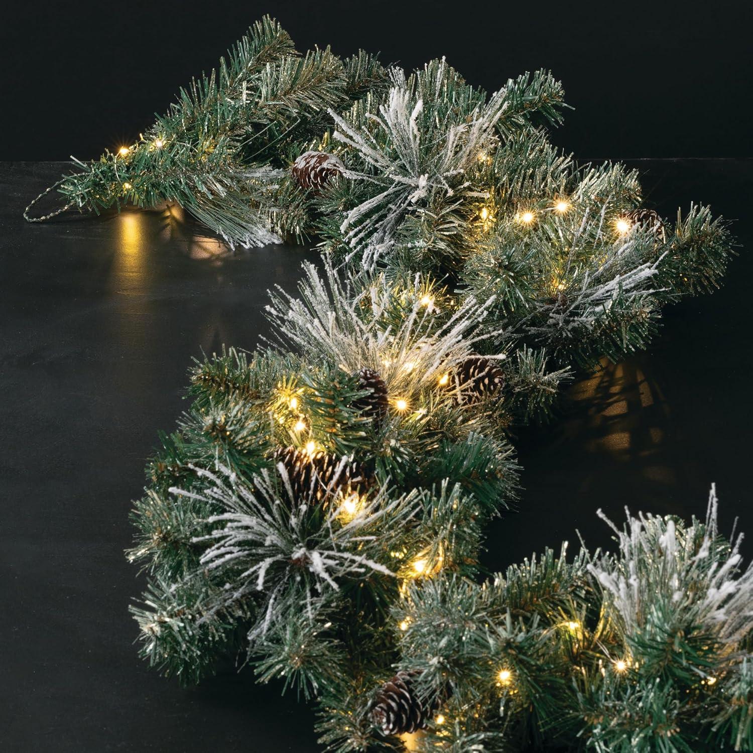 Sullivans 9-Foot Pre-lit Artificial Mixed Pine Christmas Garland Decorated with Pinecones, Light Flocking, Gold Glittered Accents, and Warm White