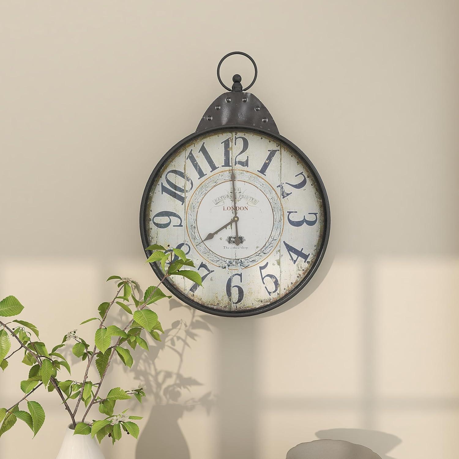 DecMode 20" Black Metal Finial Distressed Pocket Watch Inspired Wall Clock with Beige Clockface