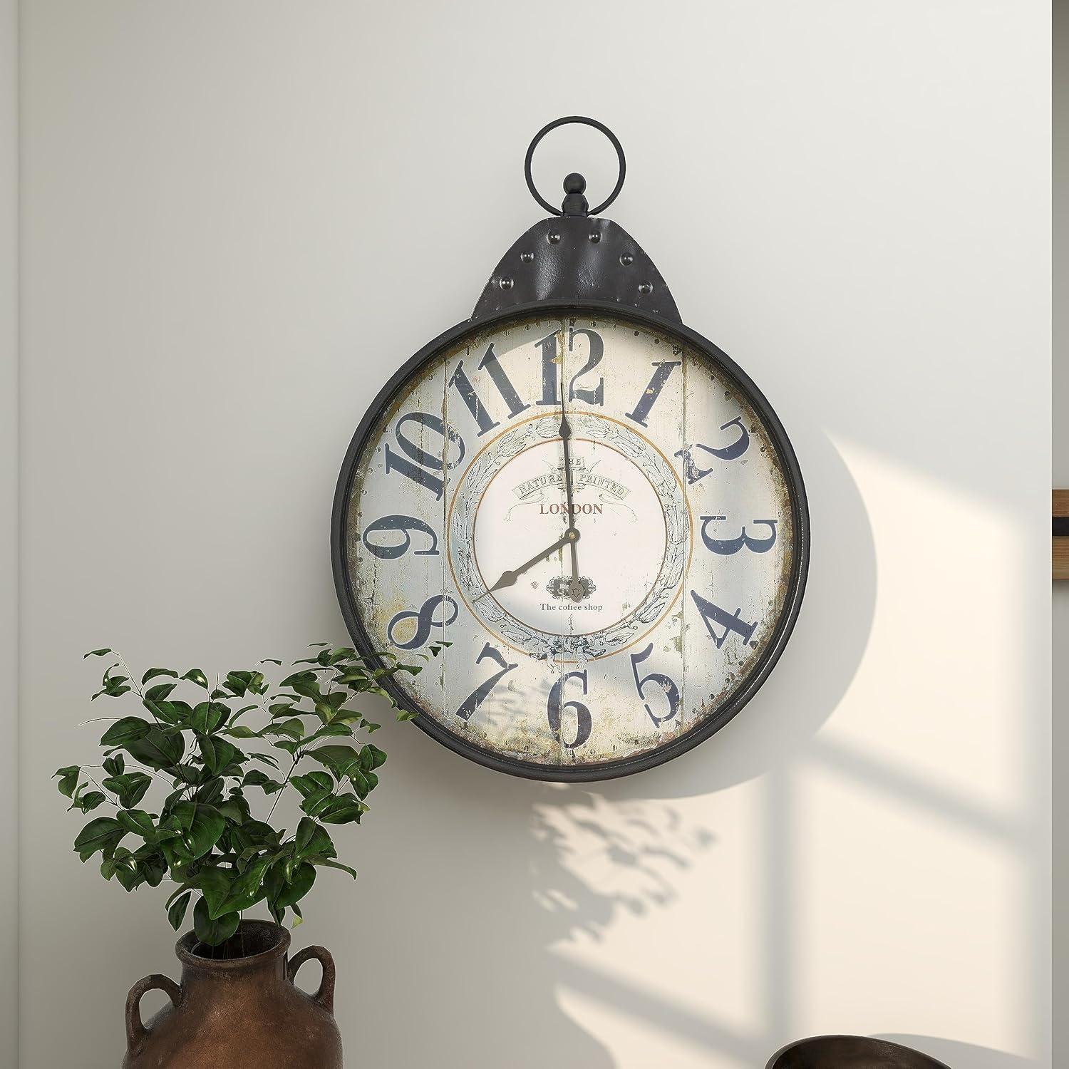 DecMode 20" Black Metal Finial Distressed Pocket Watch Inspired Wall Clock with Beige Clockface