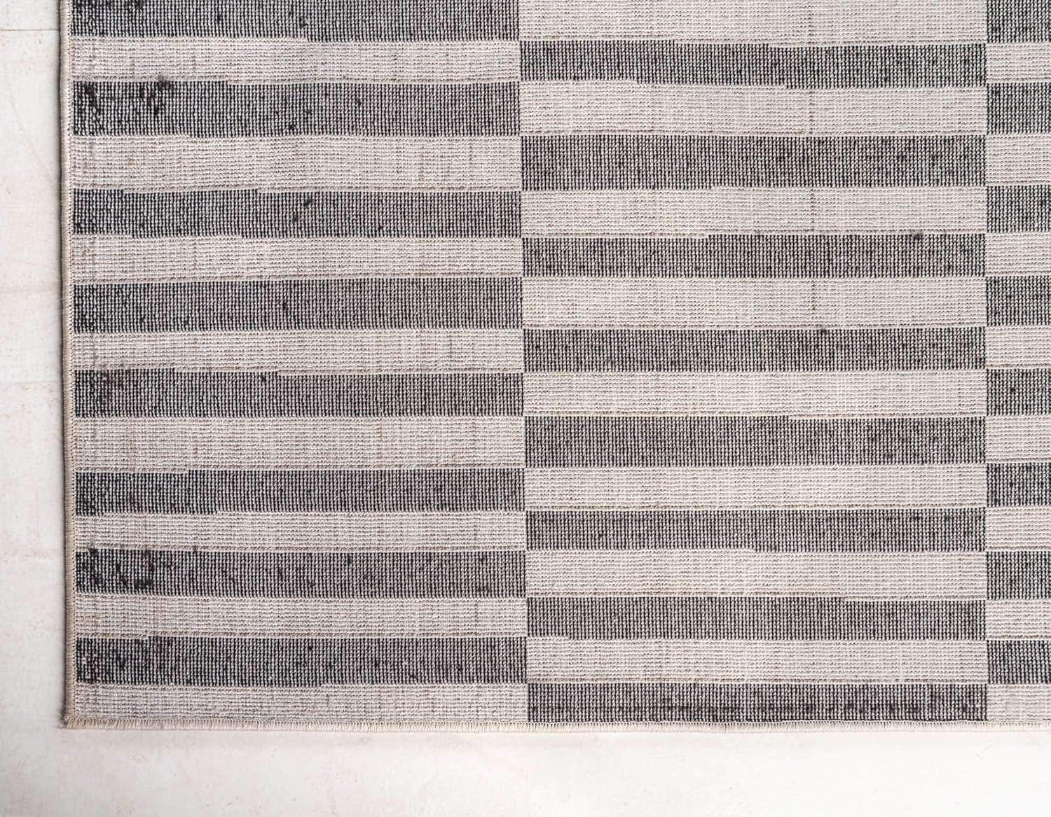 Black and Ivory Striped Synthetic 4' x 6' Area Rug