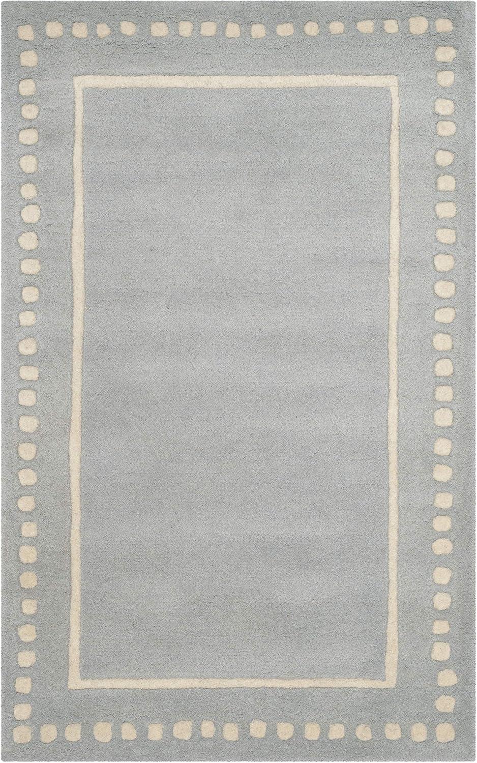 SAFAVIEH Bella Danita Plain Dotted Bordered Wool Area Rug, Light Blue/Ivory, 2' x 3'