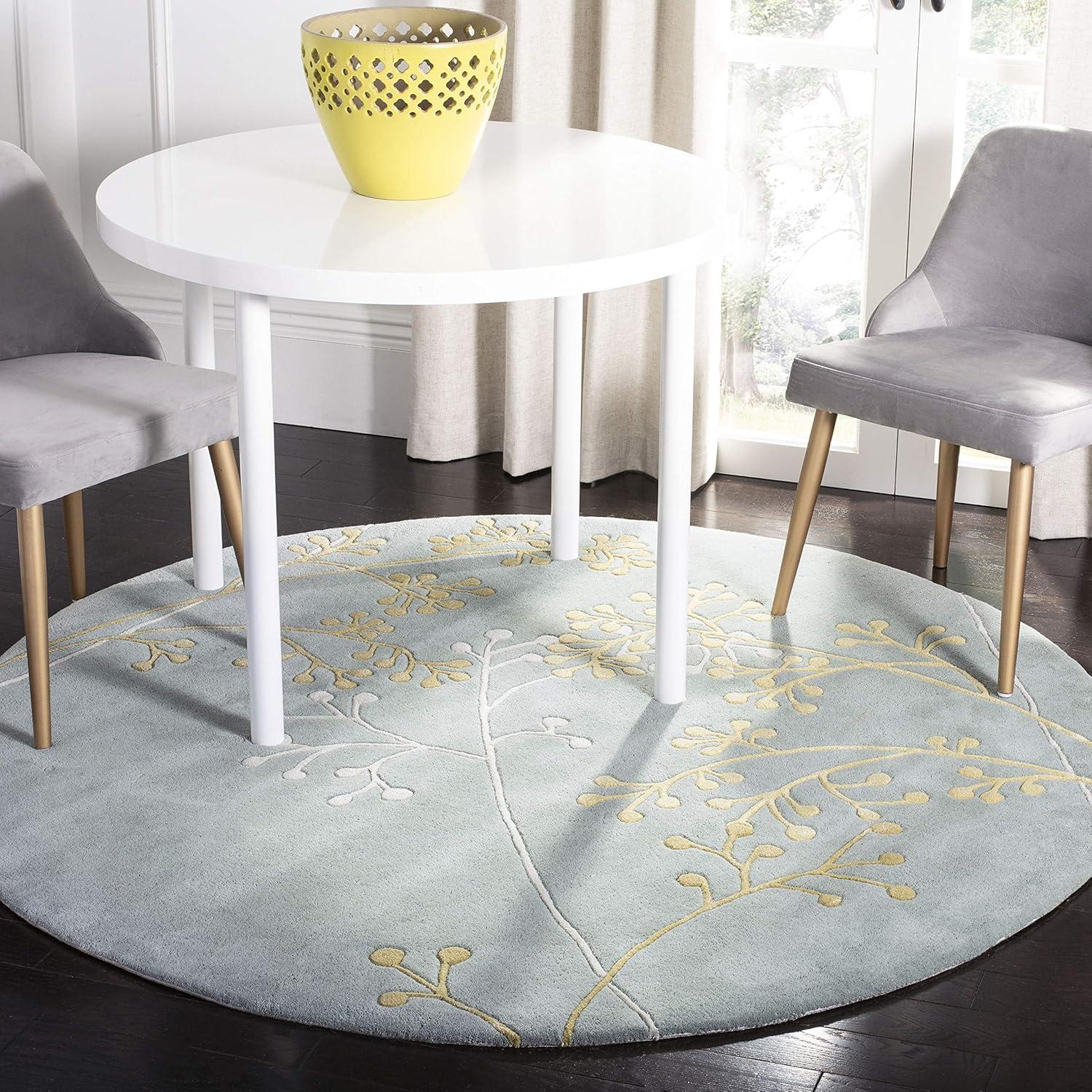Soho SOH305 Hand Tufted Area Rug - Light Blue - 8' round - Safavieh.