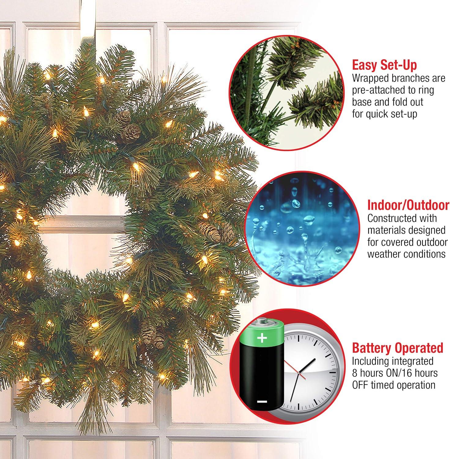 National Tree Company Pre-Lit Artificial Christmas Wreath, Green, Carolina Pine, White Lights, Decorated with Pine Cones, Christmas Collection, 24 Inches