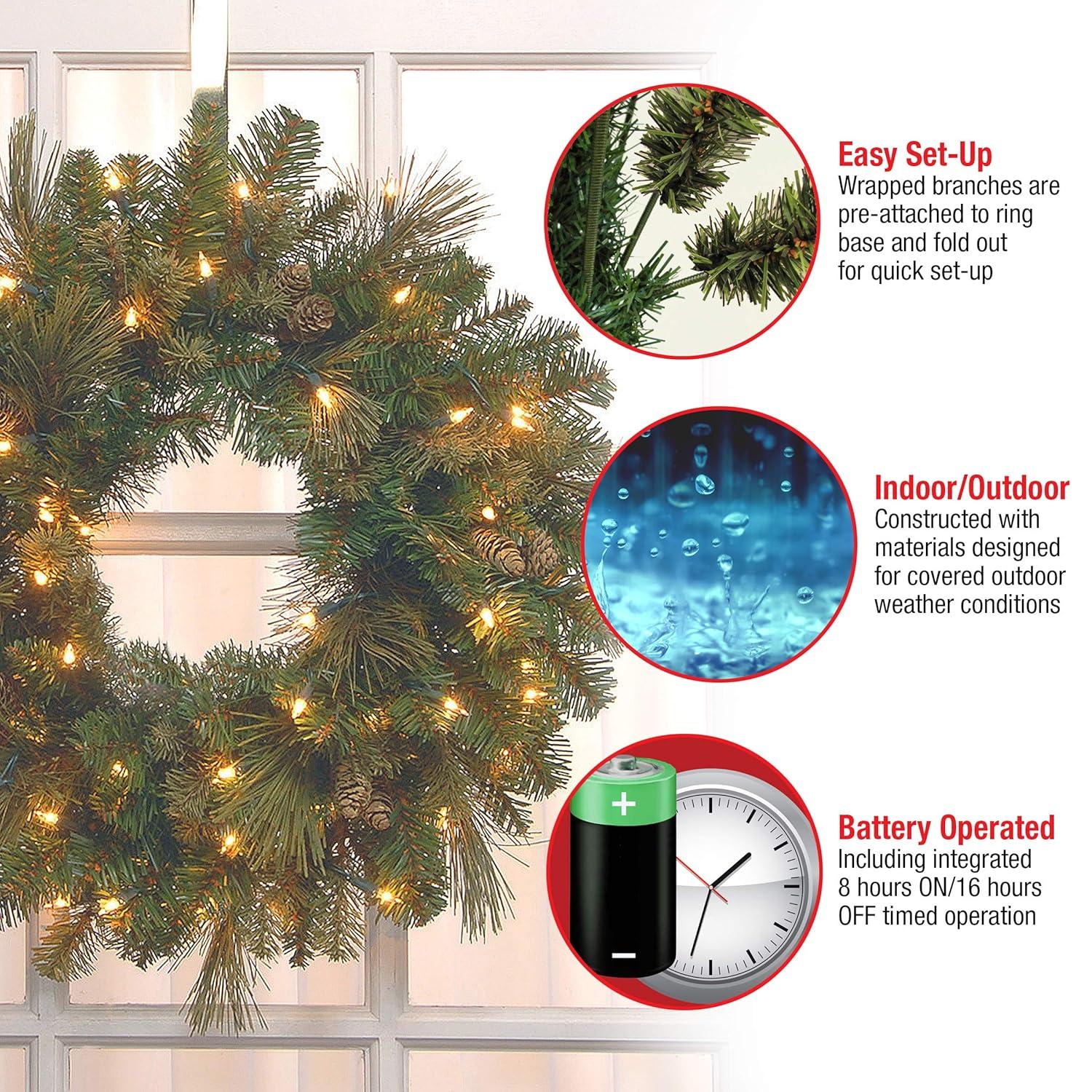 National Tree Company Pre-Lit Artificial Christmas Wreath, Green, Carolina Pine, White Lights, Decorated with Pine Cones, Christmas Collection, 24 Inches