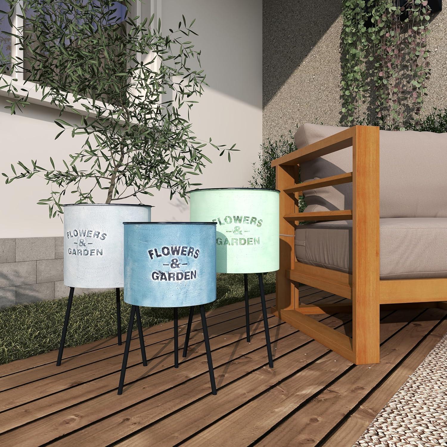 DecMode 20", 18", 16"H Blue Metal Text Planter with Flowers And Garden Text and Black Tripod Legs (3 Count)