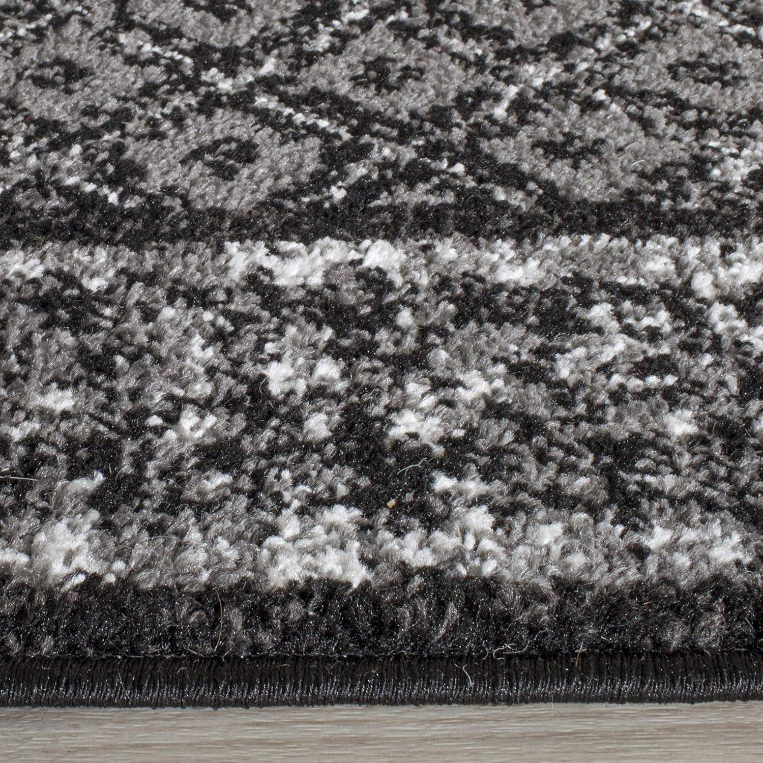 6' x 9' Black and Silver Synthetic Reversible Area Rug