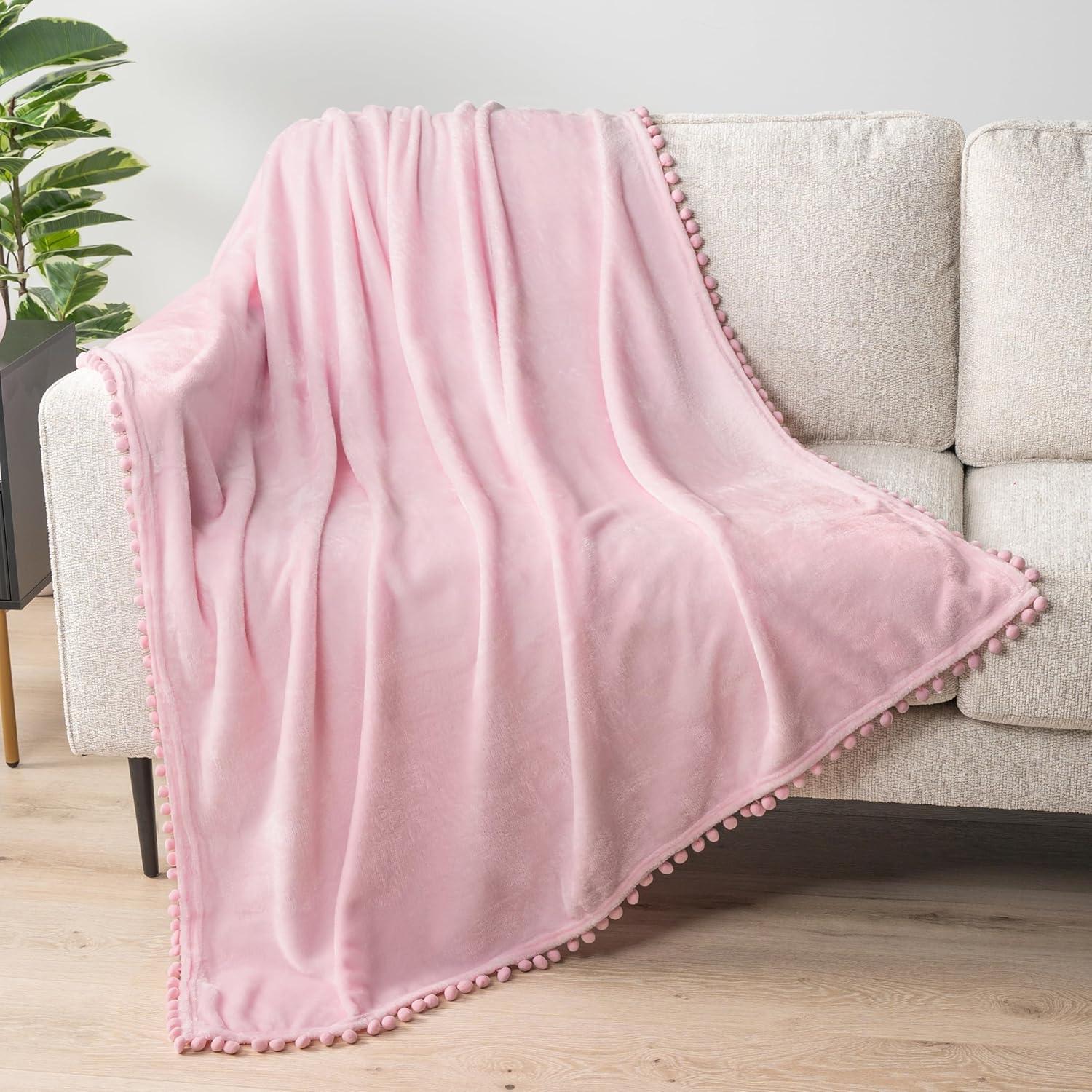 PAVILIA Fleece Throw Blanket for Couch with Pom Pom Fringe, Light Pink, Soft Cozy Fuzzy Flannel Blanket for Sofa Bed, Lightweight Plush All Season Throw, 50x60 Inches