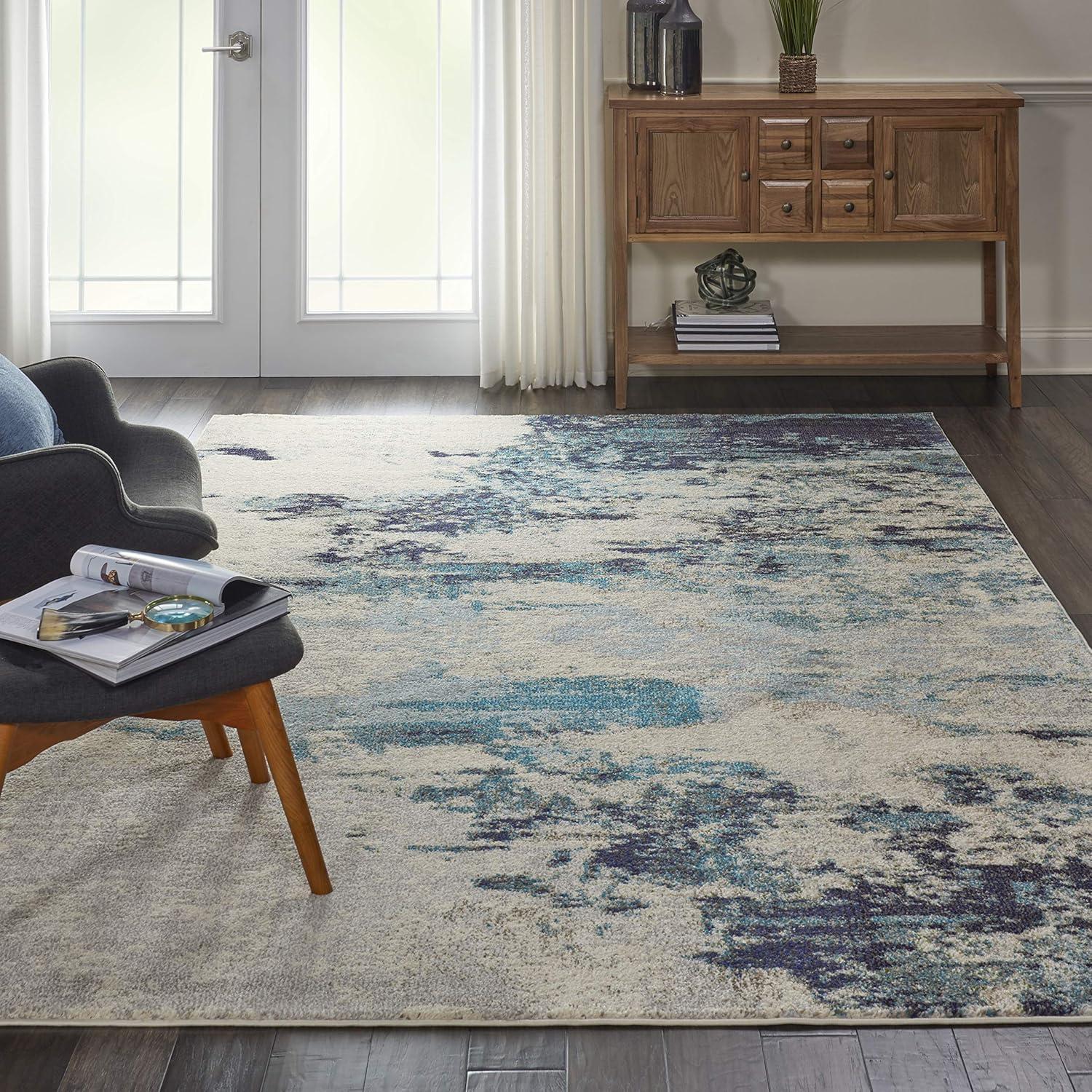 Ivory and Teal Blue Abstract 6' x 9' Synthetic Area Rug