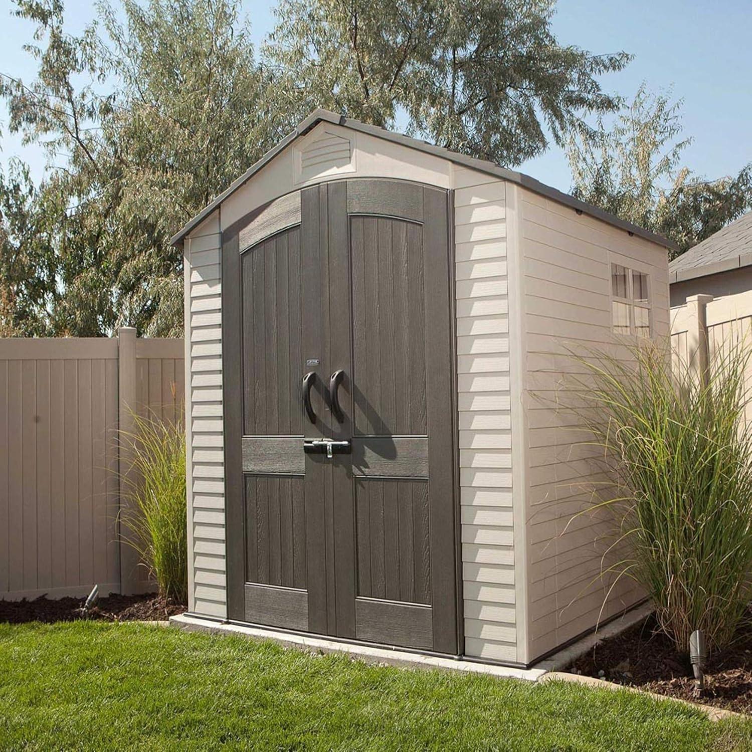 Tan and Brown Polyethylene Outdoor Storage Shed with Shelving and Windows