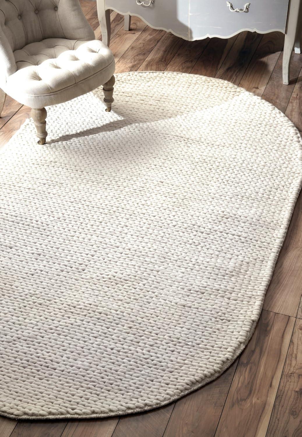 Handmade Off White Wool Oval Braided Rug 10' x 14'