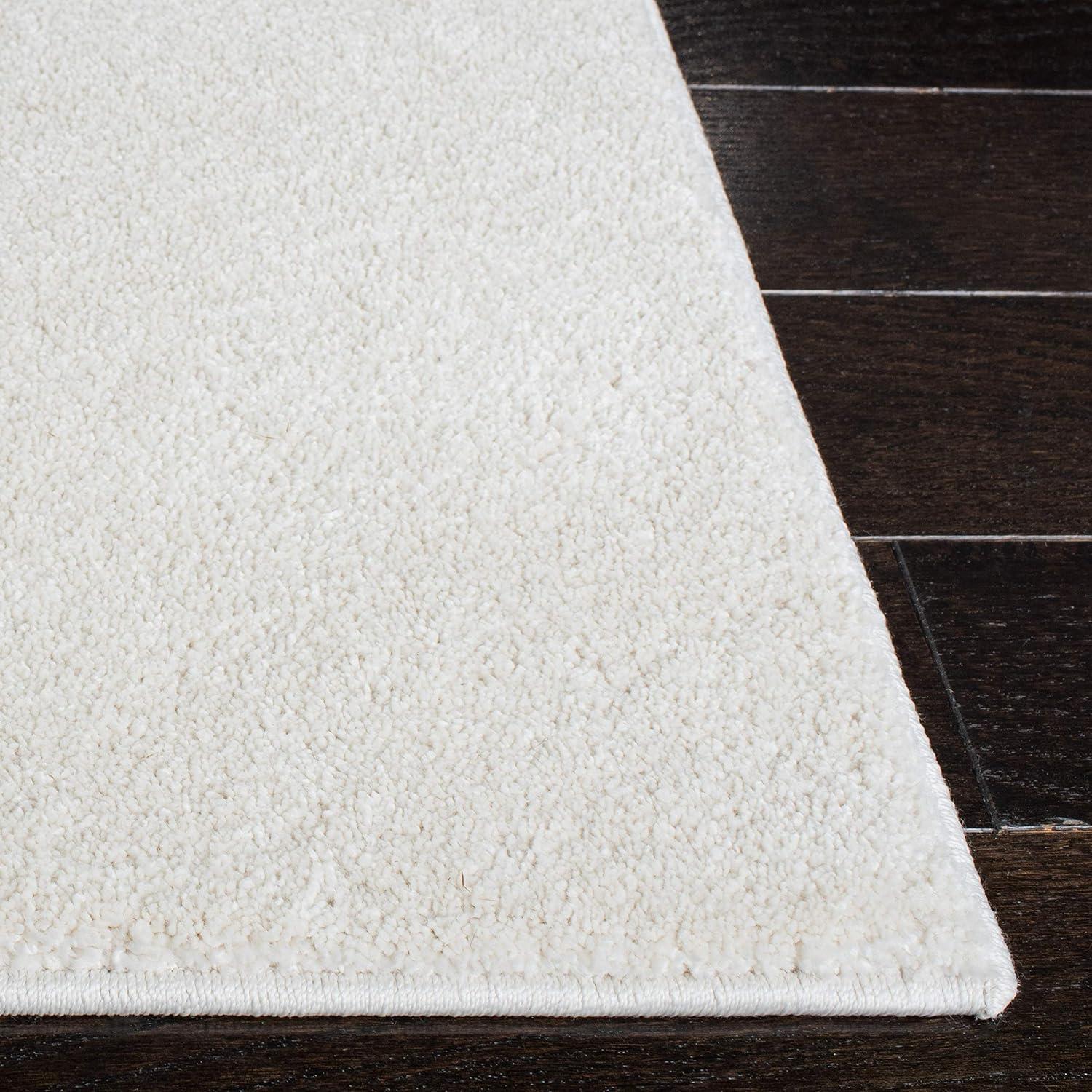 SAFAVIEH Plain and Solid Carleen Solid Plush Area Rug, Ivory, 4'5" x 6'5"