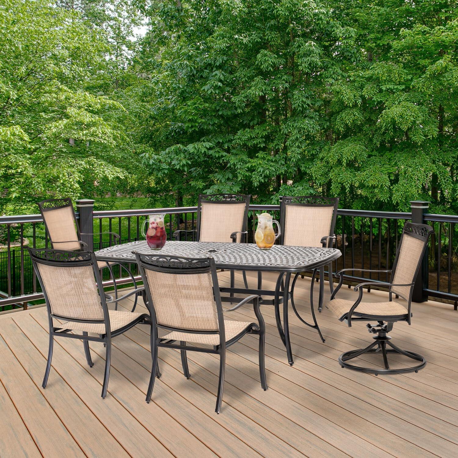 Hanover Fontana 7-Piece Outdoor Dining Set with 2 Sling Swivel Rockers, 4 Sling Chairs, and a 38-In. x 72-In. Cast-Top Table