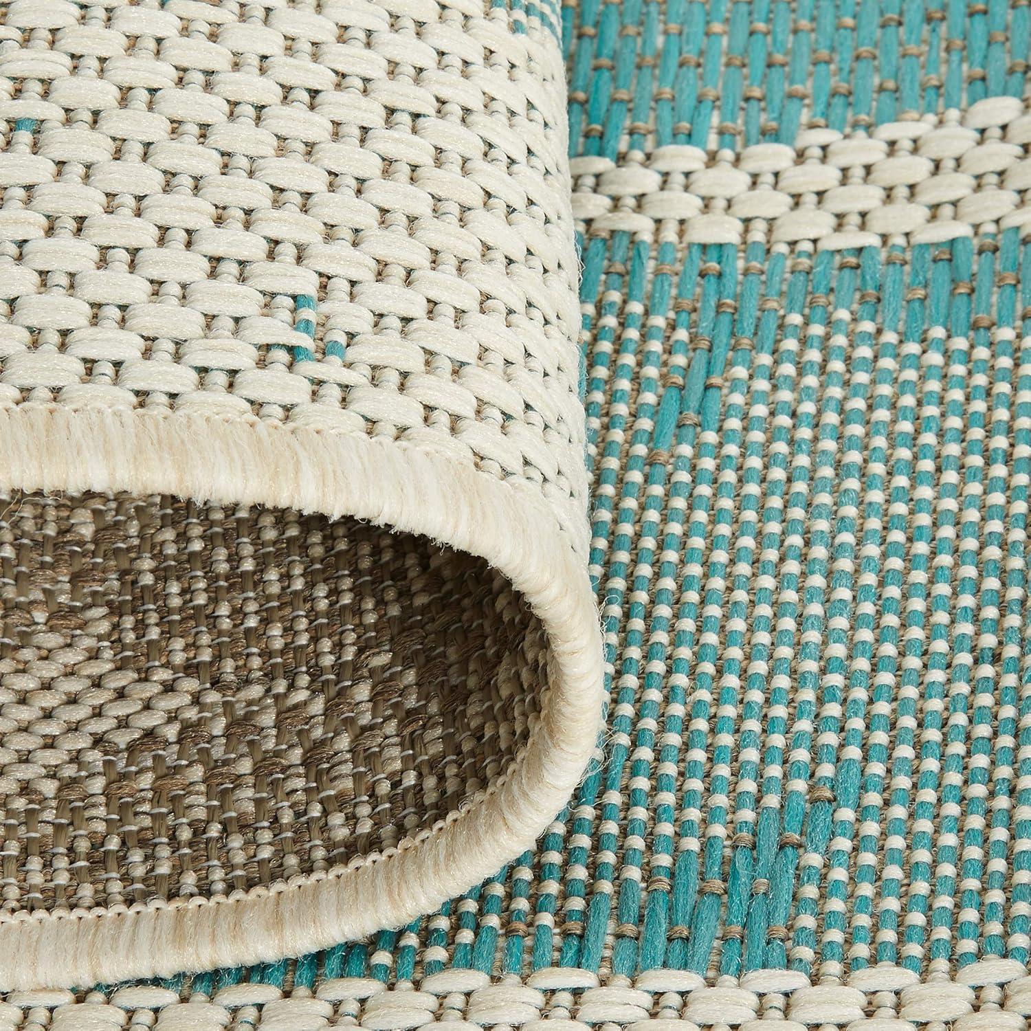 Ivory and Turquoise Synthetic Flat Woven Reversible Area Rug