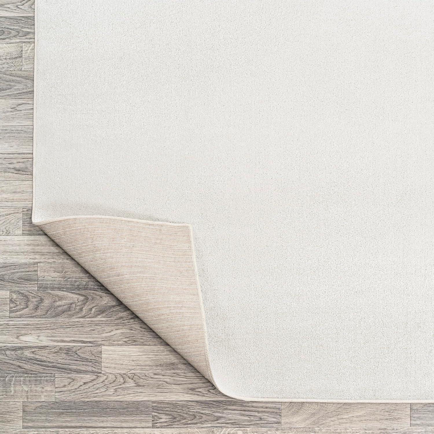 JONATHAN Y Twyla Classic Solid Low-Pile Machine-Washable Cream 4 ft. x 6 ft. Area Rug