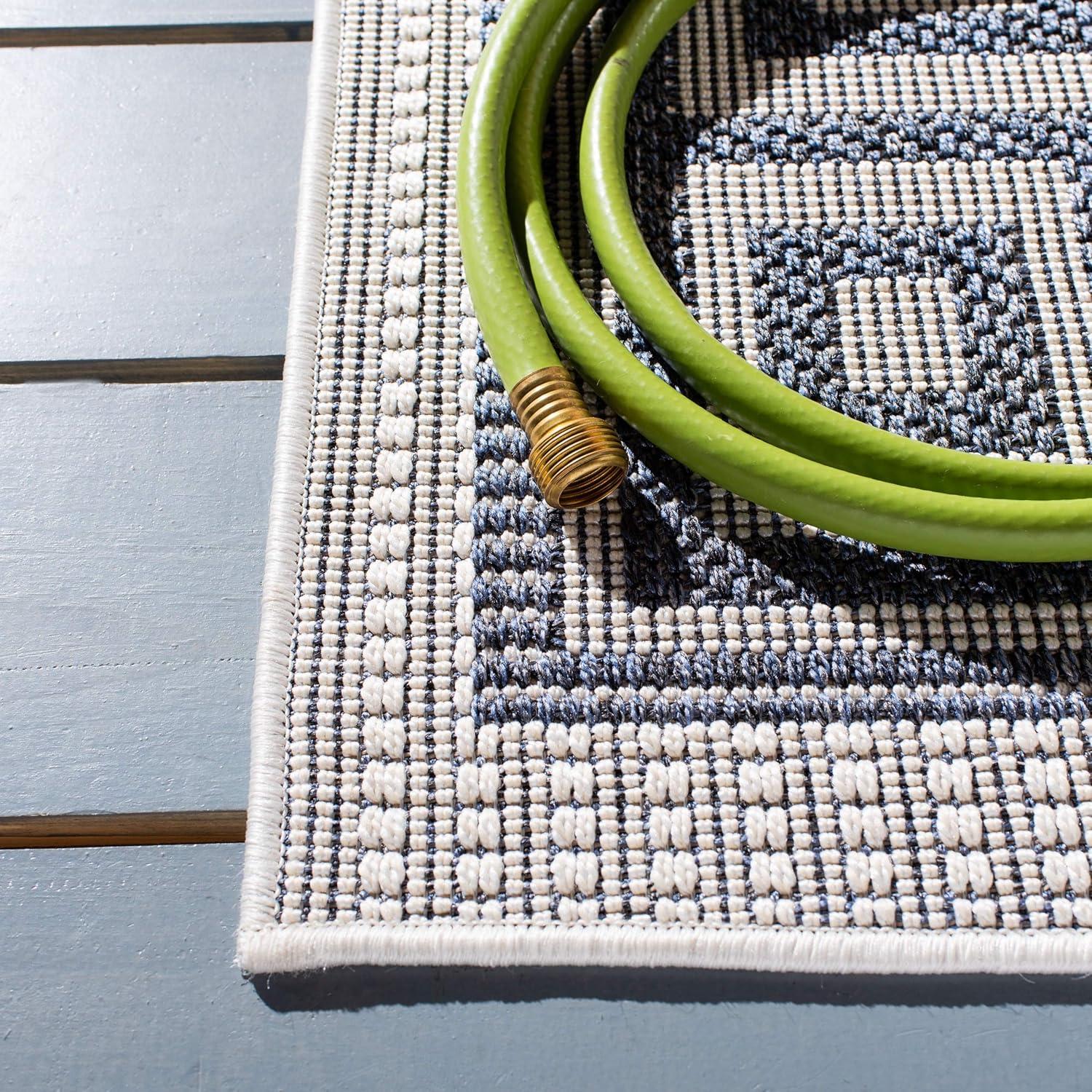 SAFAVIEH Bermuda Isidora Geometric Machine Washable Indoor/Outdoor Area Rug, Ivory/Blue, 5'3" x 7'6"