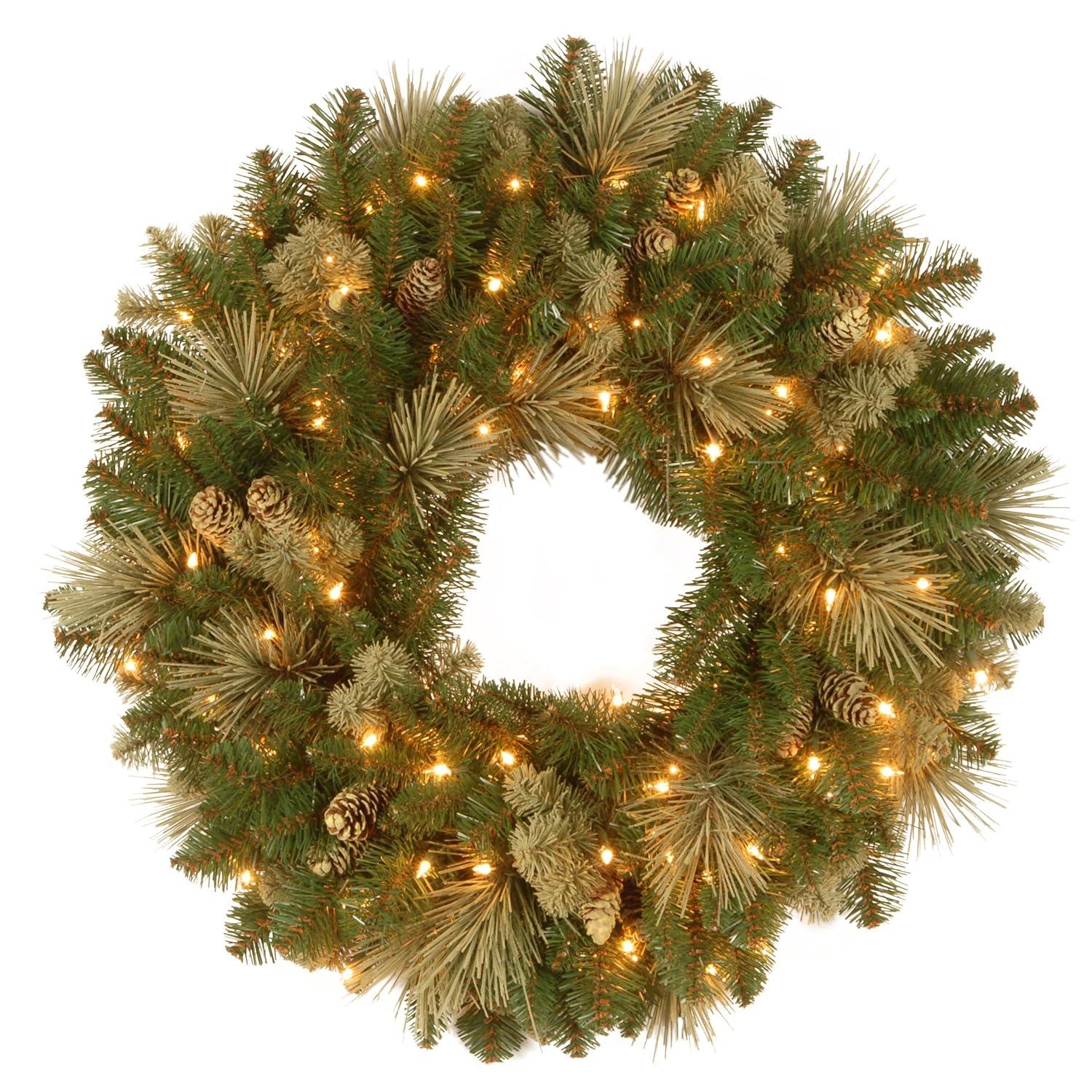 National Tree Company Pre-Lit Artificial Christmas Wreath, Green, Carolina Pine, White Lights, Decorated with Pine Cones, Christmas Collection, 24 Inches