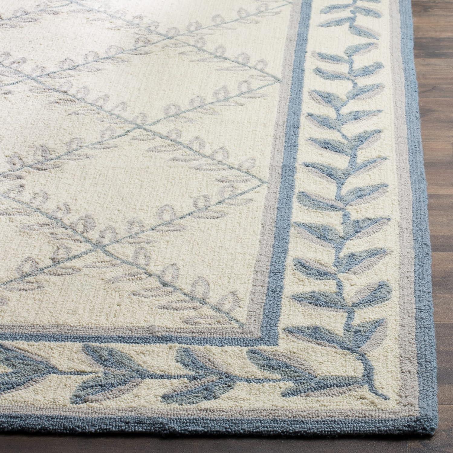 Ivory and Light Blue Tufted Synthetic Area Rug, 2' x 3'