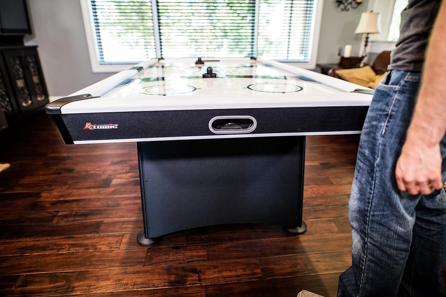 Atomic Blazer 7' Air Hockey Table with Heavy-Duty Blower, Electronic Scoring, Leg Levelers, and Overhang Rail