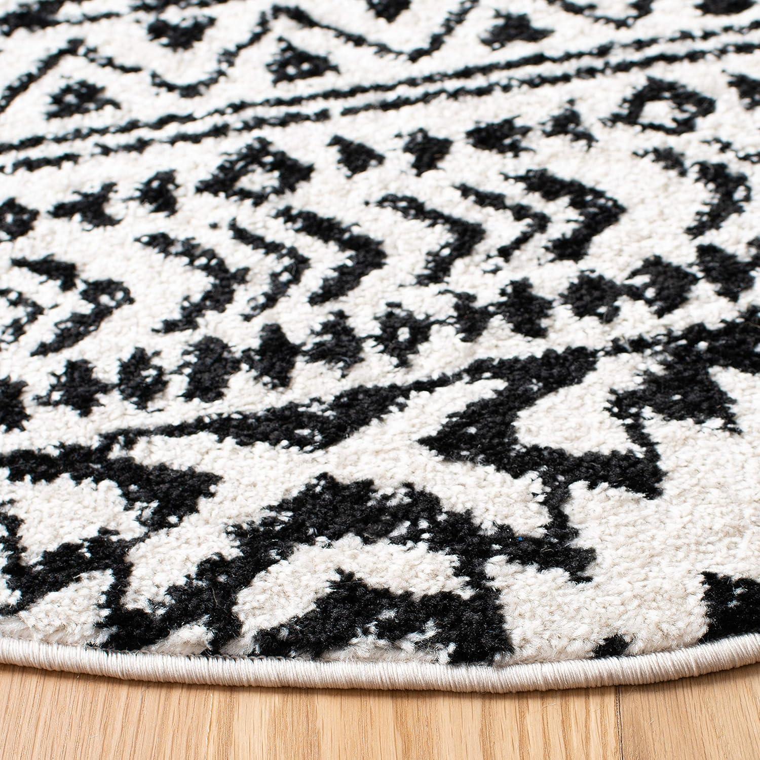 Ivory & Black Moroccan Boho 4' Round Synthetic Area Rug