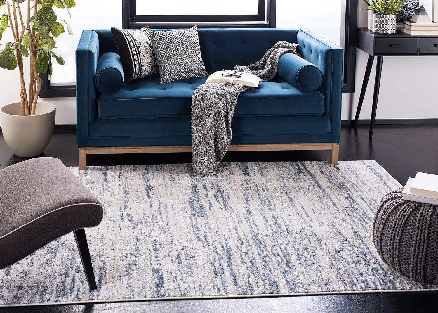 Ivory and Blue Abstract 8' x 10' Stain-Resistant Area Rug