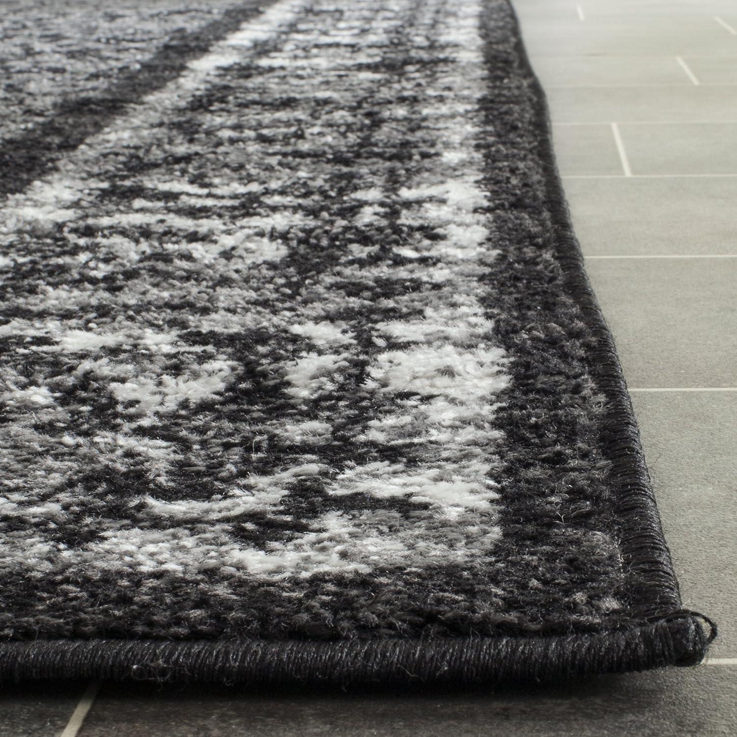 6' x 9' Black and Silver Synthetic Reversible Area Rug