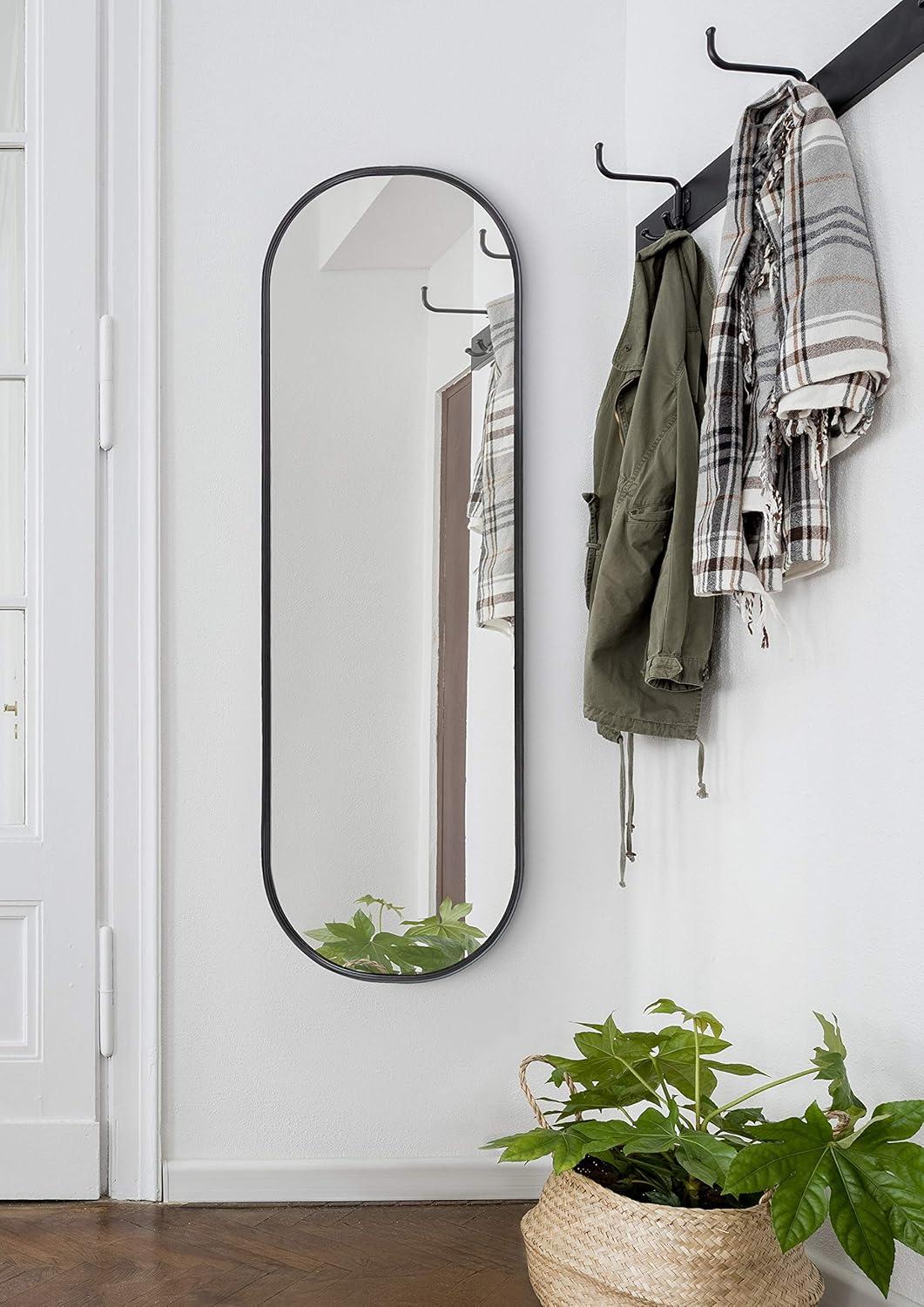 Kate and Laurel Caskill Modern Oval Mirror, 16" x 48", Black, Capsule-Shaped Accent Mirror for Entryway, Living Room, or Bathroom