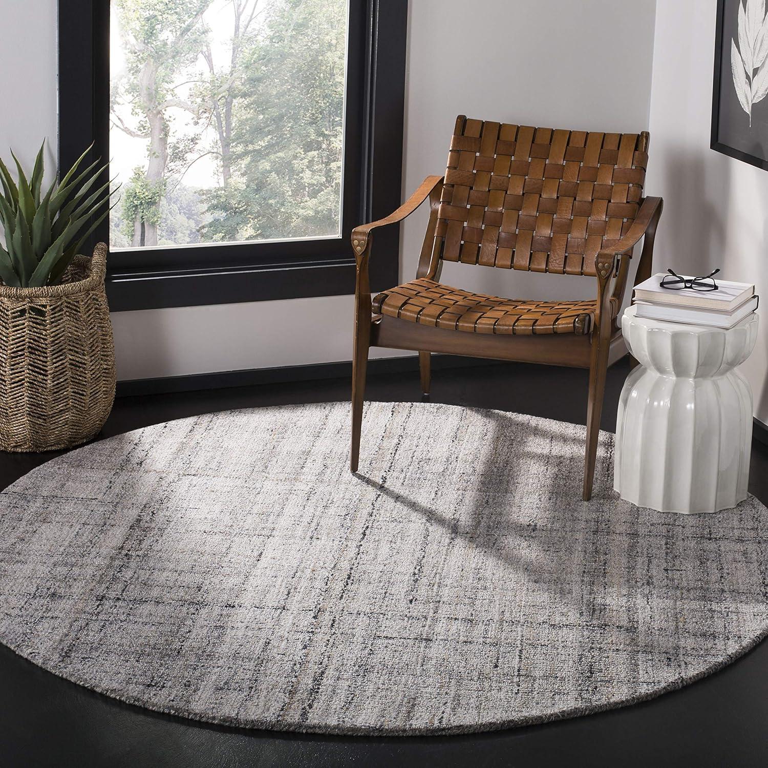 Handmade Black and Camel Round Wool Abstract Rug